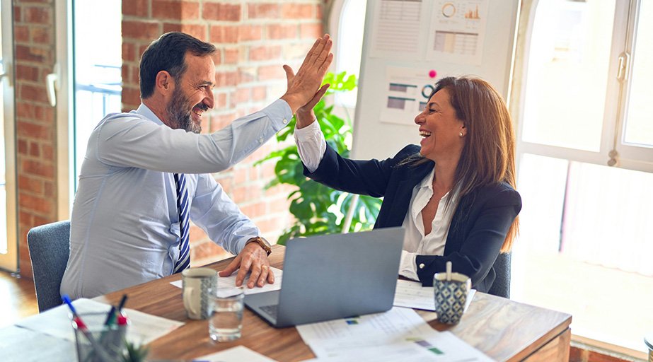 Two team members giving a high five.